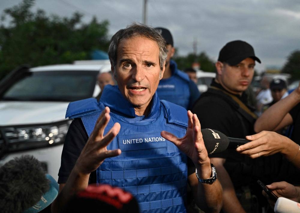 International Atomic Energy Agency (IAEA) chief Rafael Grossi talks to the press on a road outside Zaporizhzhia city, after his visit to the Russian-held Zaporizhzhia nuclear power plant in southern Ukraine on September 1, 2022. — AFP pic