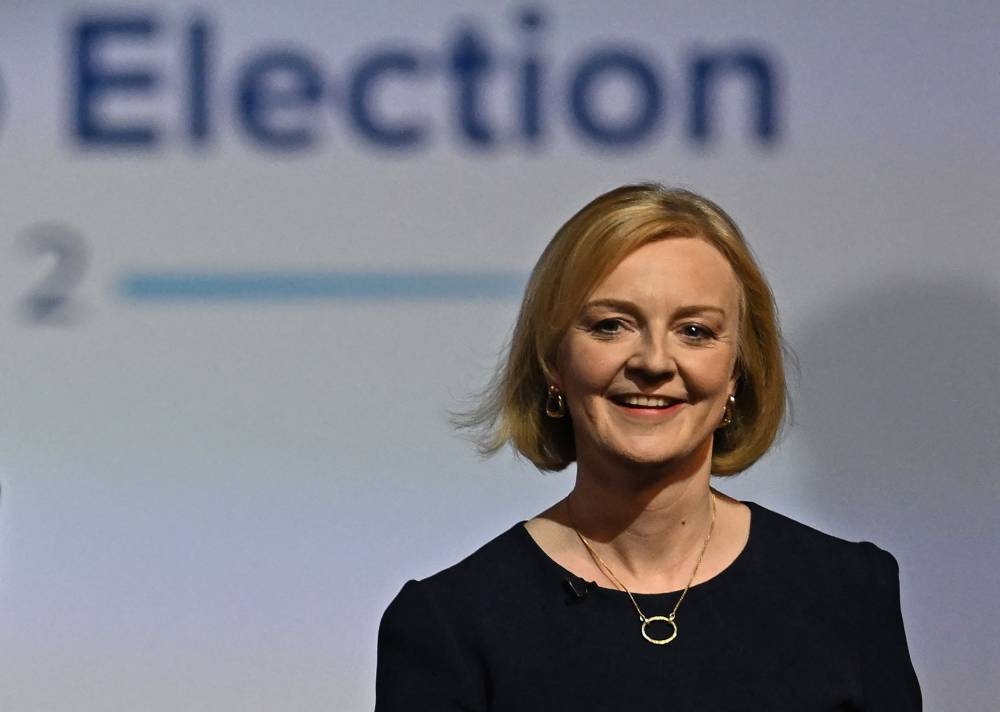 Contender to become the country's next Prime minister and leader of the Conservative party British Foreign Secretary Liz Truss arrives for a Conservative Party Hustings event in Manchester, north-west England, on August 19, 2022. — AFP pic