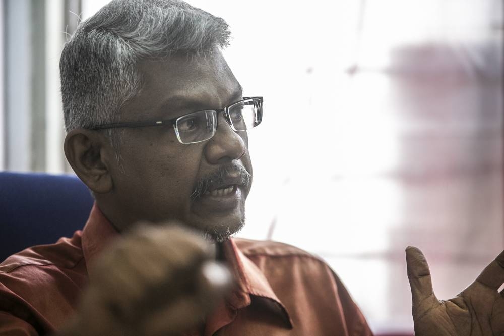 PSM secretary-general Sivarajan Arumugam speaking to Malay Mail during an interview at PSM's headquarters in Brickfields August 15, 2022. — Picture by Hari Anggara