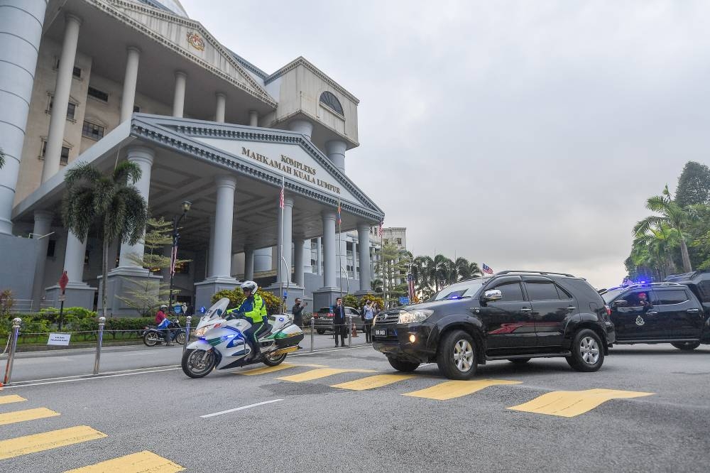 A motorcade carrying Datuk Seri Najib Razak arrives at the compound of the Kuala Lumpur Court Complex after his 1MDB trial, September 2, 2022. Najib filed the petition for a royal pardon on September 2, which was well within the 14-day period from the day of the Federal Court’s dismissal of his appeal on August 23. — Picture by Shafwan Zaidon