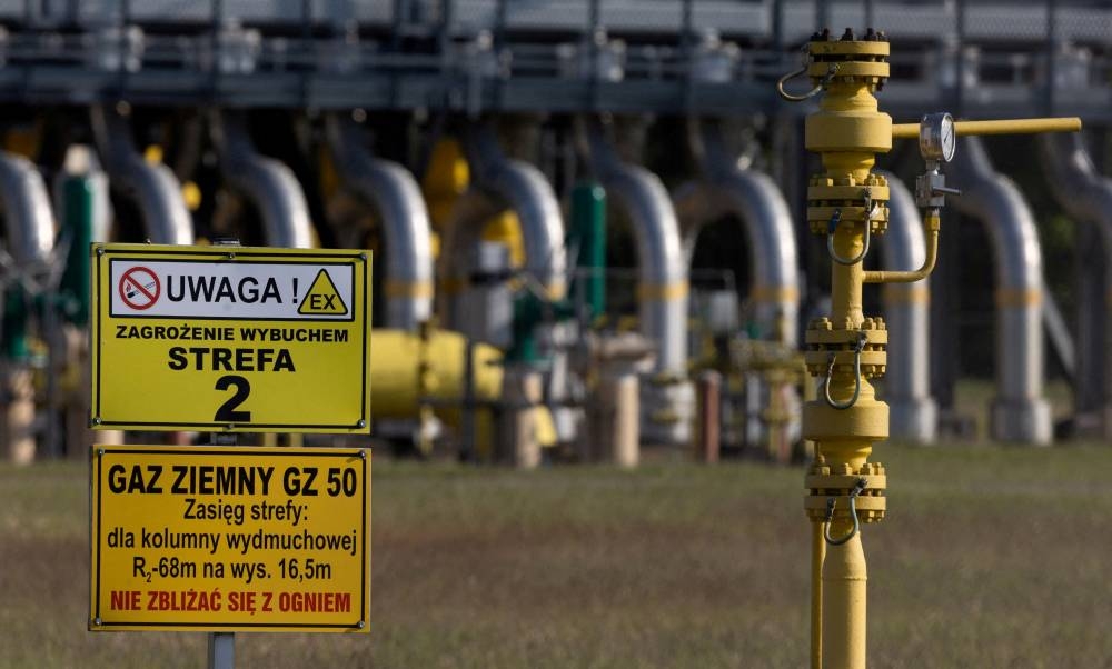 Warning signs are pictured in front of the gas compressor station, a part of Polish section of the Yamal pipeline that links Russia with western Europe which is owned by a joint venture of Gazprom and PGNiG but it is operated by Poland’s state-owned gas transmission company Gaz-System, in Gabinek near Wloclawek, Poland May 23, 2022. The signs read: ‘Attention! Explosion risk. Zone 2’ and ‘Natural gas. Keep fire away.’ — Reuters pic