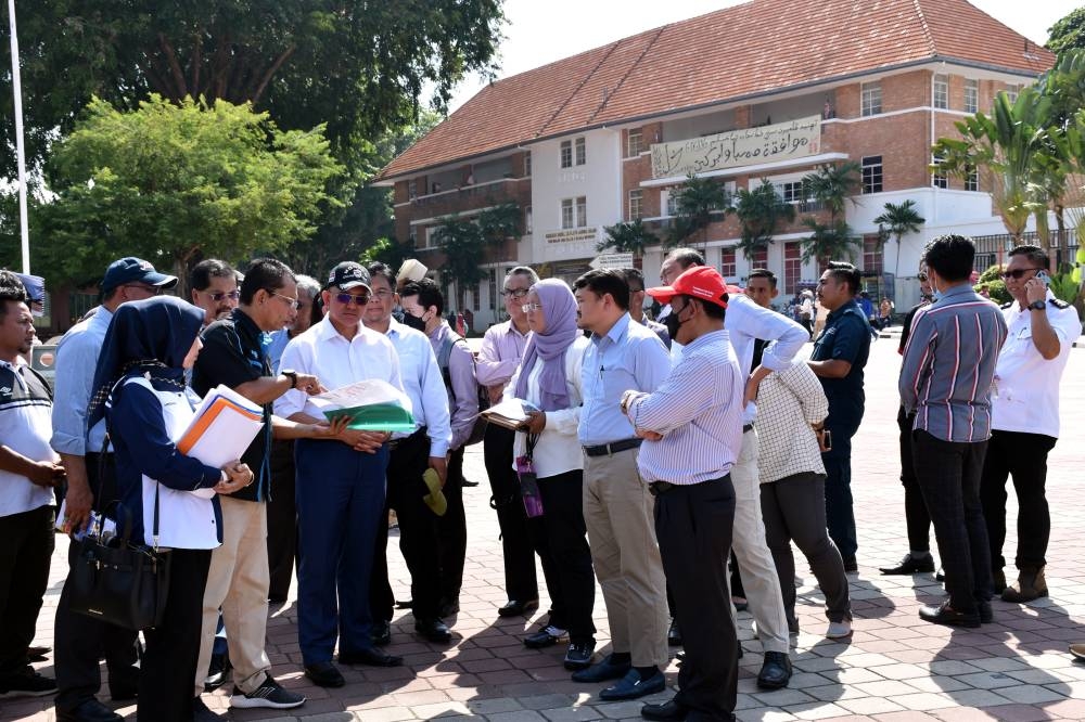 Communications and Multimedia Ministry secretary-general Datuk Seri Mohammad Mentek (front row, 3rd left) visits the celebration venue for the Malaysia Day 2022 celebration at the Proclamation of Independence Memorial in Bandar Hilir September 6, 2022. — Bernama pic