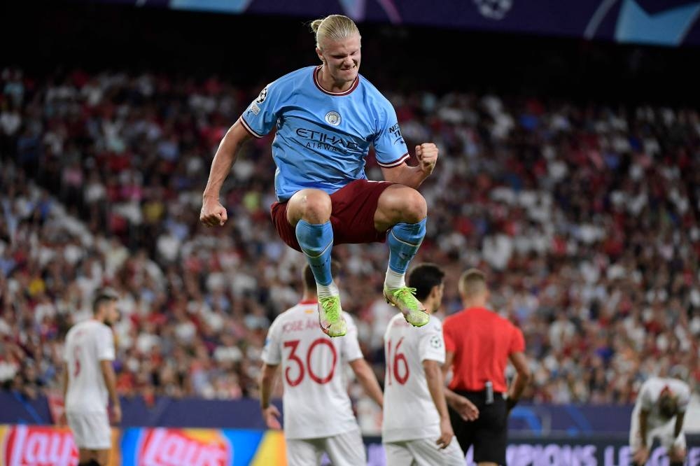 Manchester City's Erling Haaland celebrates after scoring his team's third goal against Sevilla FC at the Ramon Sanchez Pizjuan stadium in Seville September 6, 2022. — AFP pic