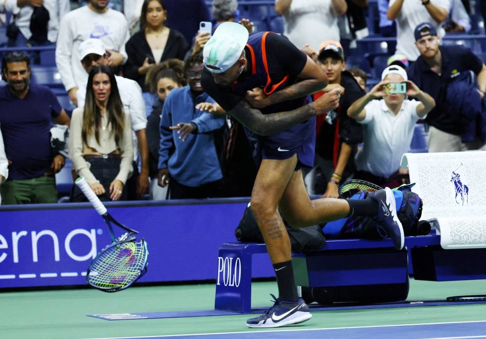 Australia's Nick Kyrgios smashes his racket after his quarter final match against Russia's Karen Khachanov in New York September 7, 2022. — Reuters pic