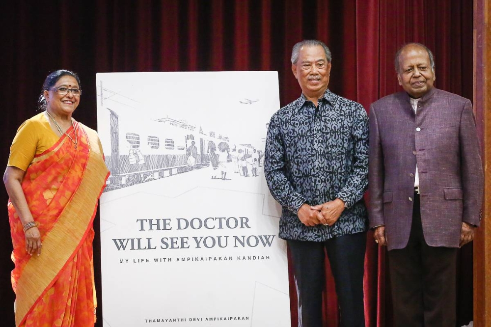 (From left) Author Puan Sri Thamayanthi Devi Ampikaipakan, Tan Sri Muhyiddin Yassin and Tan Sri Dr Ampikaipakan Kandiah during the book launch for ‘The Doctor Will See You Now My Life with Ampikaipakan Kandiah’ at the SMK Vivekananda, Brickfields in Kuala Lumpur, September 7, 2022. — Picture by Yusof Mat Isa