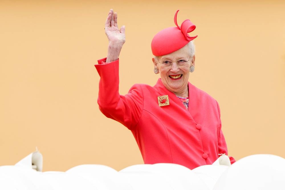 In this file photo taken on June 3, 2022 Queen Margrethe II of Denmark waves as she arrives aboard the Royal Yacht Dannebrog in Aarhus Municipality, Denmark. ― AFP pic