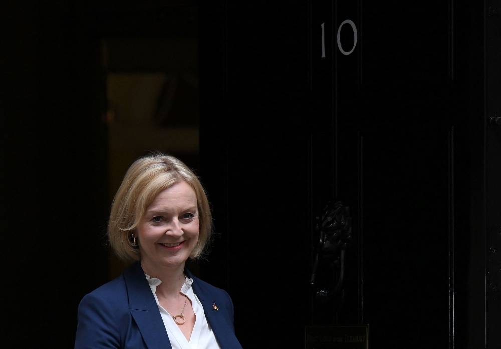 Britain's Prime Minister Liz Truss leaves from 10 Downing Street in central London on September 7, 2022, for the House of Commons to take part in her first Prime Minister's Questions (PMQs). — AFP pic