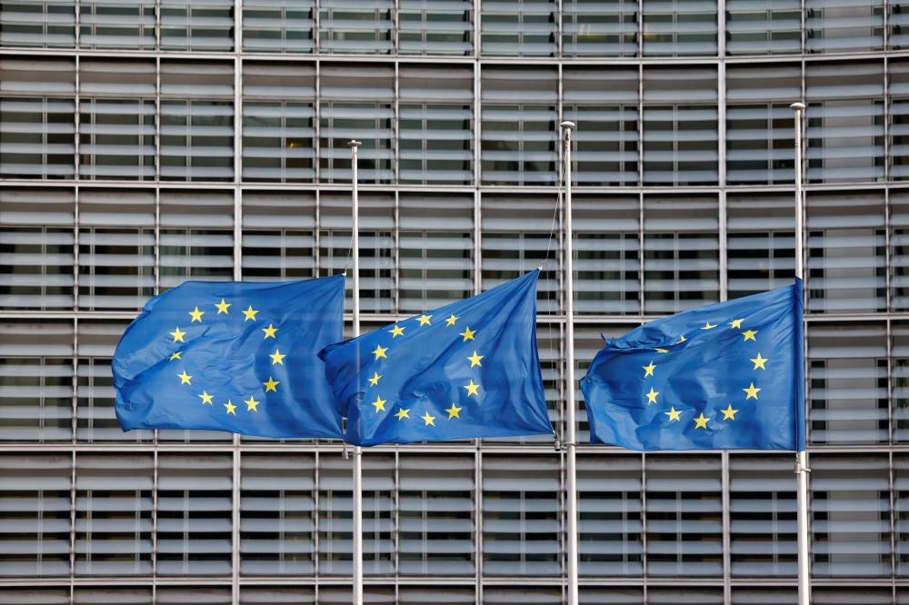 European Union flags fly at half-mast outside the European Commission headquarters, following the passing of Britain’s Queen Elizabeth, in Brussels, Belgium, September 9, 2022. ― Reuters pic