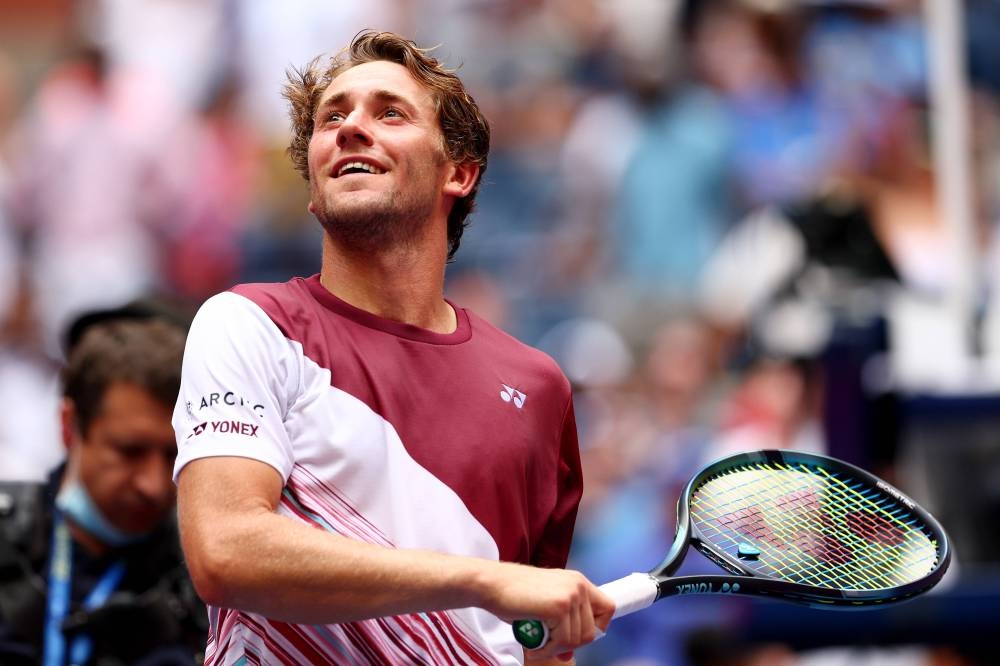 Casper Ruud of Norway hits balls into the crowd after a match win against Corentin Moutet of France during their Men's Singles Fourth Round match of the 2022 US Open on September 4, 2022 in New York City. —  Elsa/Getty Images/AFP pic