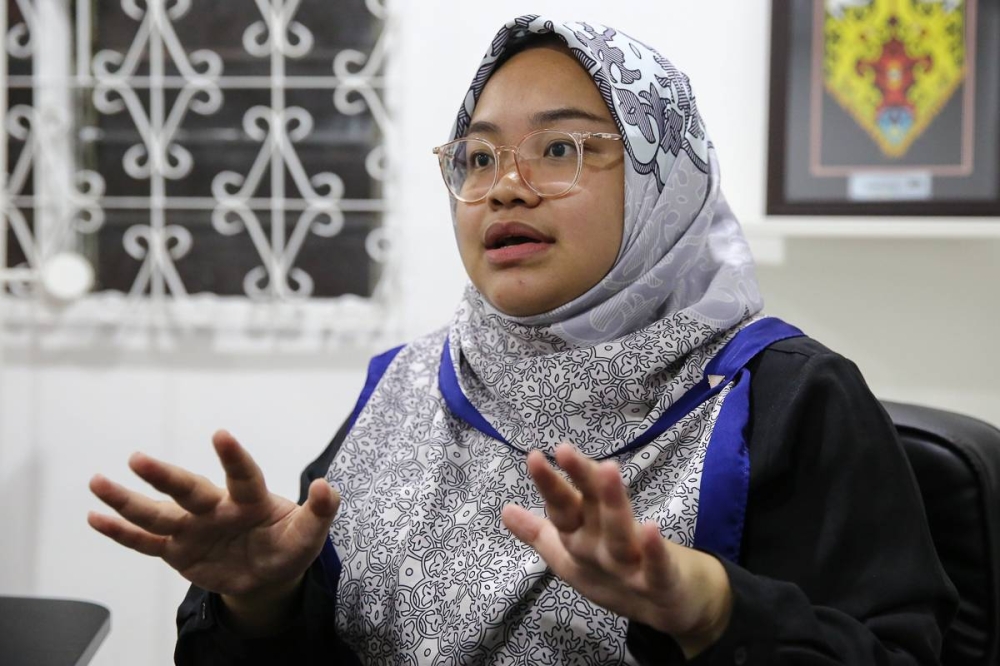 Muda deputy president Amira Aisya Abdul Aziz speaks to Malay Mail during an interview at her office in Petaling Jaya August 18, 2022. — Picture by Yusof Mat Isa