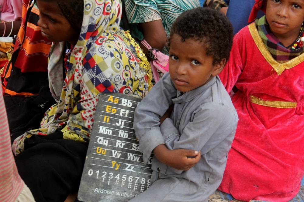 A child sits at a makeshift open-air classroom as part of a mobile school program offering a rare chance of education for their nomadic community, at a nomad camp in Toukra, outside N'Djamena, Chad, September 1, 2022. — Reuters pic