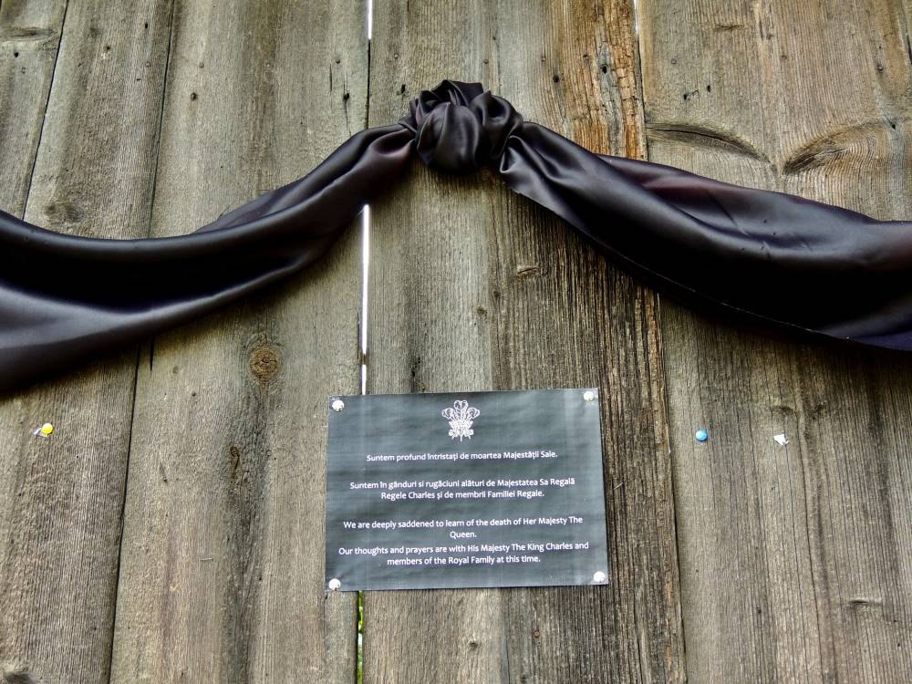 A mourning black ribbon and a message of condolence are seen on the gate of the 18th century cottage owned by Britain's King Charles, bought through his charity foundation, in the Transylvanian village of Viscri, a Unesco World Heritage site, Romania, September 11, 2022. — Reuters pic