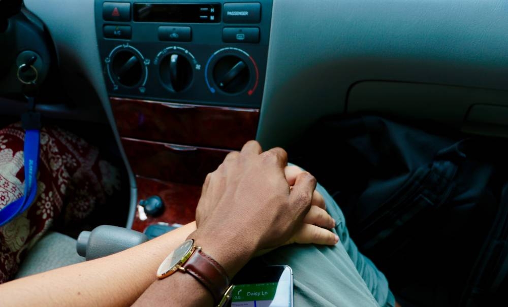 After finally getting pulled over by police, the driver and his passenger were allegedly found in a compromising position that involved more than just holding hands. — Unsplash pic