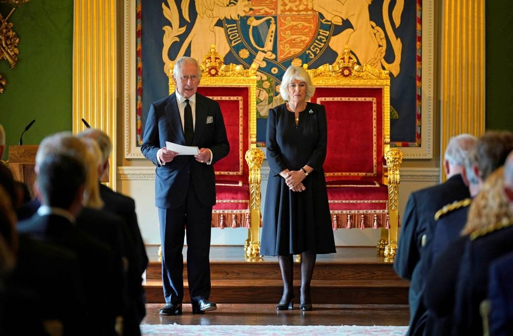 King Charles III, with the Queen Consort, speaking after receiving a Message of Condolence by Alex Maskey, the Speaker of the Northern Ireland Assembly, at Hillsborough Castle September 13, 2022. ― Niall Carson/Pool via Reuters