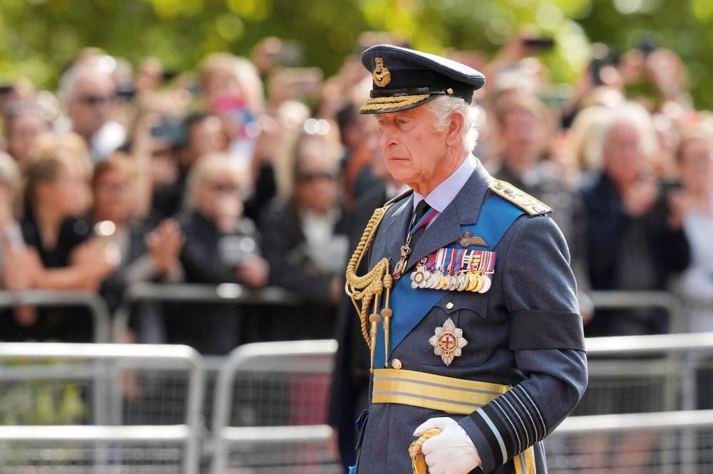 Britain's King Charles III follows the coffin of Queen Elizabeth II during a procession from Buckingham Palace to Westminster Hall in London September 14, 2022. — Martin Meissner/Pool pic via Reuters