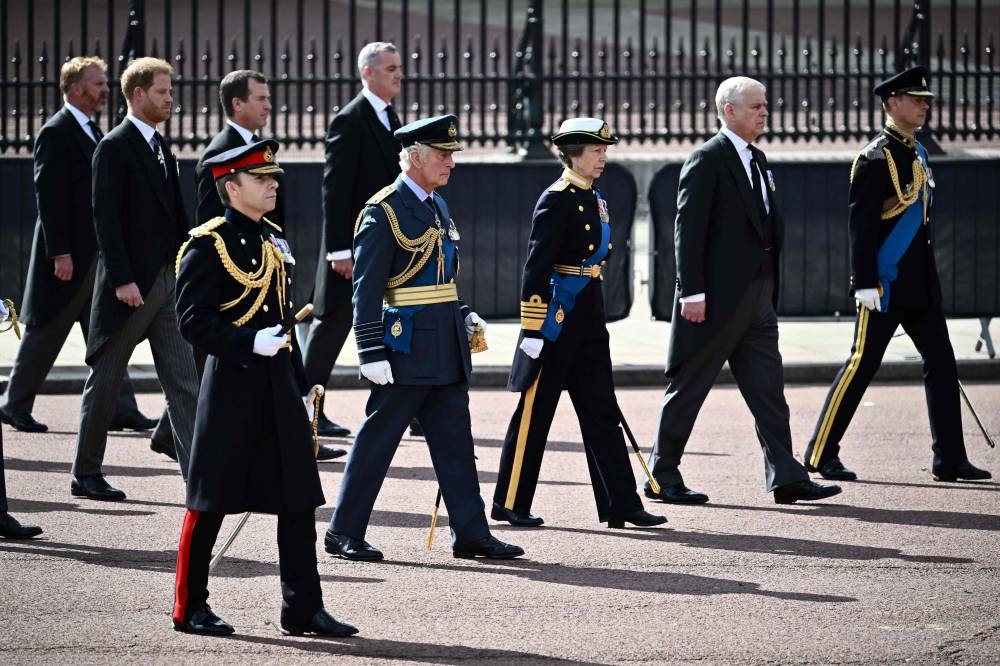 Britain’s Prince Harry, Duke of Sussex (2nd left), King Charles III (6th left); Princess Anne, Princess Royal; Prince Andrew, Duke of York (2nd right) and Prince Edward, Earl of Wessex walk behind the coffin of Queen Elizabeth II, adorned with a Royal Standard and the Imperial State Crown and pulled by a Gun Carriage of The King’s Troop Royal Horse Artillery, during a procession from Buckingham Palace to the Palace of Westminster, in London September 14, 2022. — AFP pic