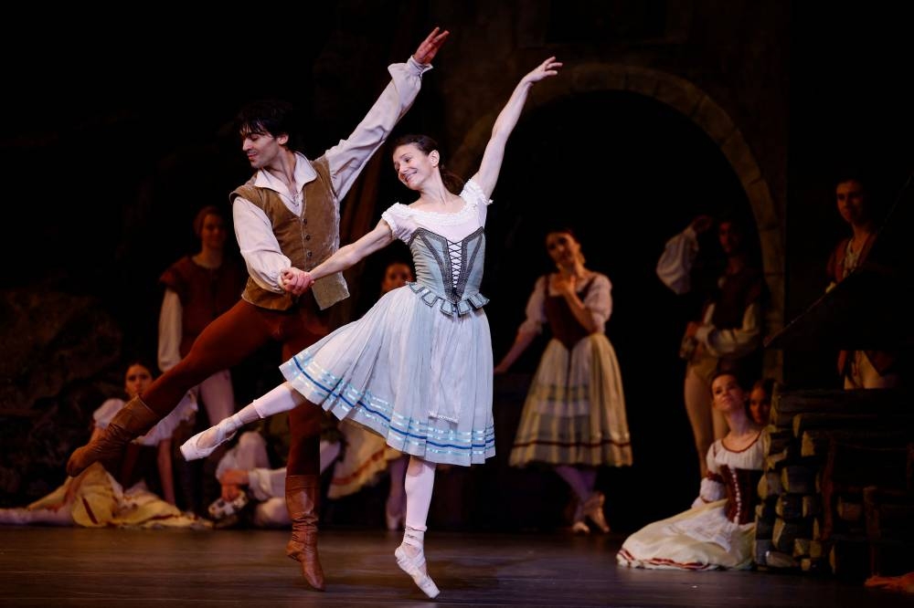 Dancers Alina Cojocaru and Alexandr Trusch perform during a dress rehearsal for 'Giselle', a show by the United Ukrainian Ballet and produced by Russian choreographer Alexei Ratmansky, at the Coliseum Theatre in London, Britain, September 13, 2022. — Reuters pic