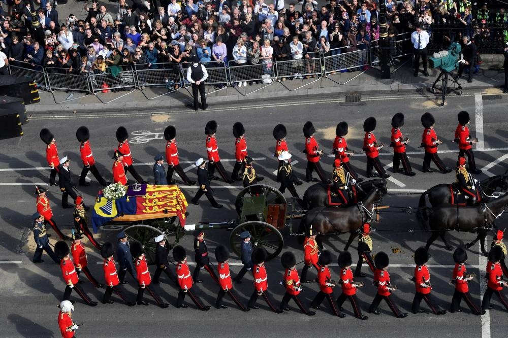 The procession of the coffin of Britain's Queen Elizabeth moves from Buckingham Palace to the Houses of Parliament for her lying in state, in London September 14, 2022. — Reuters pic