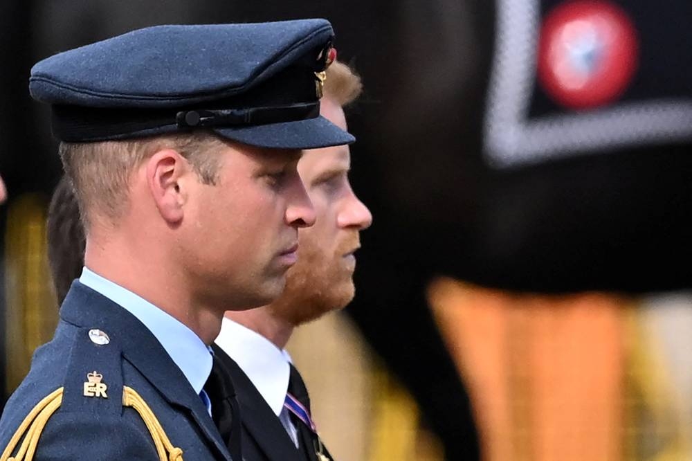 Britain’s Prince William, Prince of Wales (left) and Prince Harry, Duke of Sussex follow the coffin of Queen Elizabeth II, adorned with a Royal Standard and the Imperial State Crown and pulled by a Gun Carriage of The King’s Troop Royal Horse Artillery, during a procession from Buckingham Palace to the Palace of Westminster, in London on September 14, 2022. — Justin Tallis/Pool/Reuters pic 