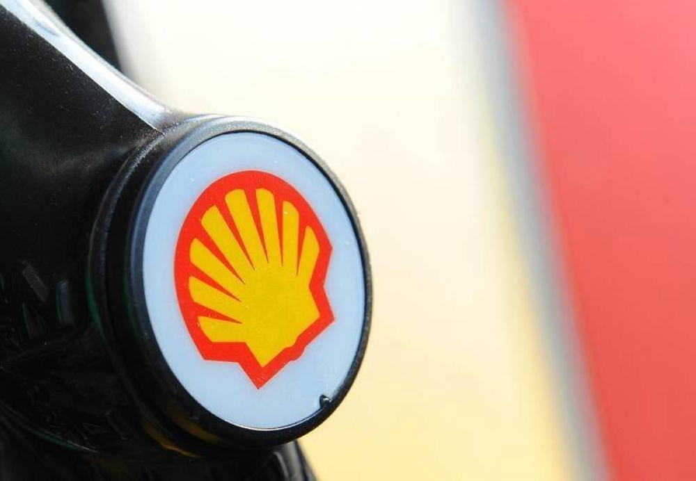 A Shell logo is seen on a pump at a petrol station in London. — Reuters pic