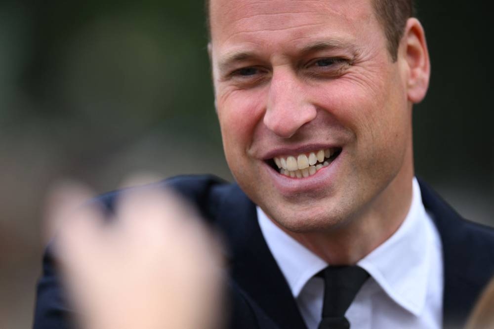 Britain’s Prince William, Prince of Wales gestures as she speaks to members of the public outside Norwich Gate on the Sandringham Estate in Sandringham, eastern England, on September 15, 2022, following the death of Queen Elizabeth II. — AFP pic