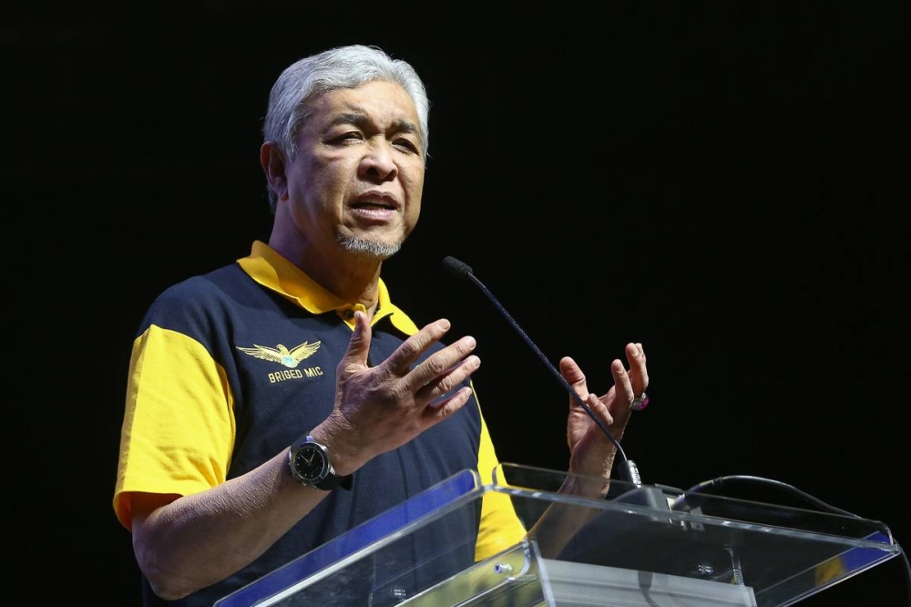 BN chairman Datuk Seri Ahmad Zahid Hamidi speaks during the launch of the National MIC Brigade at the Axiata Arena in Bukit Jalil September 18, 2022. — Picture by Yusof Mat Isa