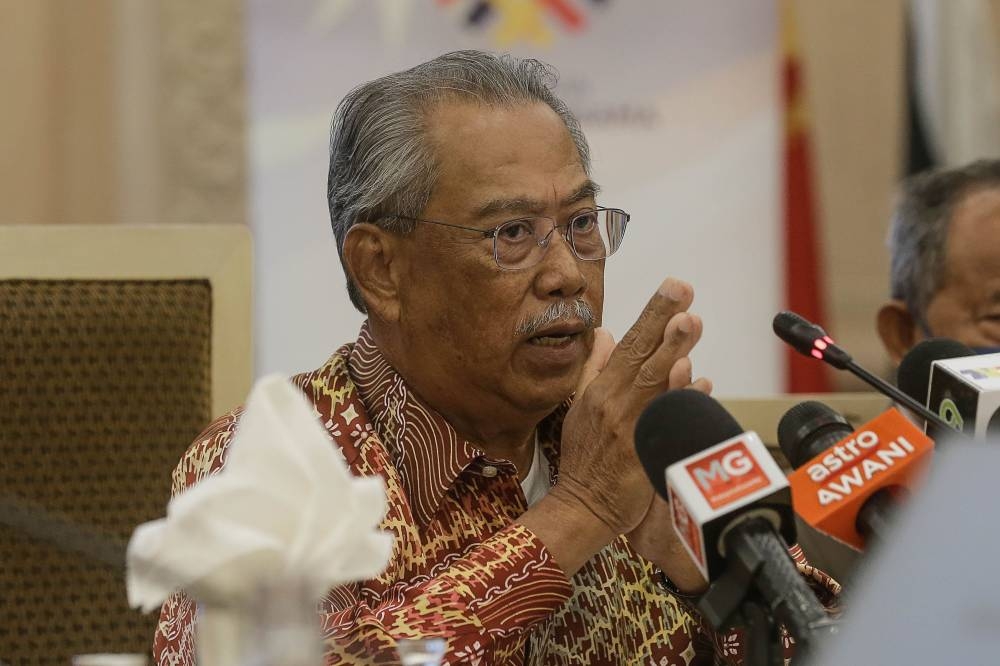 Tan Sri Muhyiddin Yassin pointed out how the decline of the ringgit’s value, increasing inflation and post-pandemic economy have brought hardship to the people. — Picture by Sayuti Zainudin