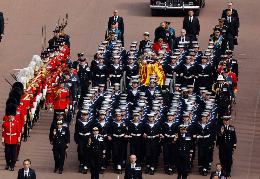 The Procession following the coffin of Queen Elizabeth II, draped in the Royal Standard, on the State Gun Carriage of the Royal Navy, travels from Westminster Abbey to Wellington Arch in London on September 19, 2022, after the State Funeral Service of Britain's Queen Elizabeth II. — Chip Somodevilla/Pool/AFP pic