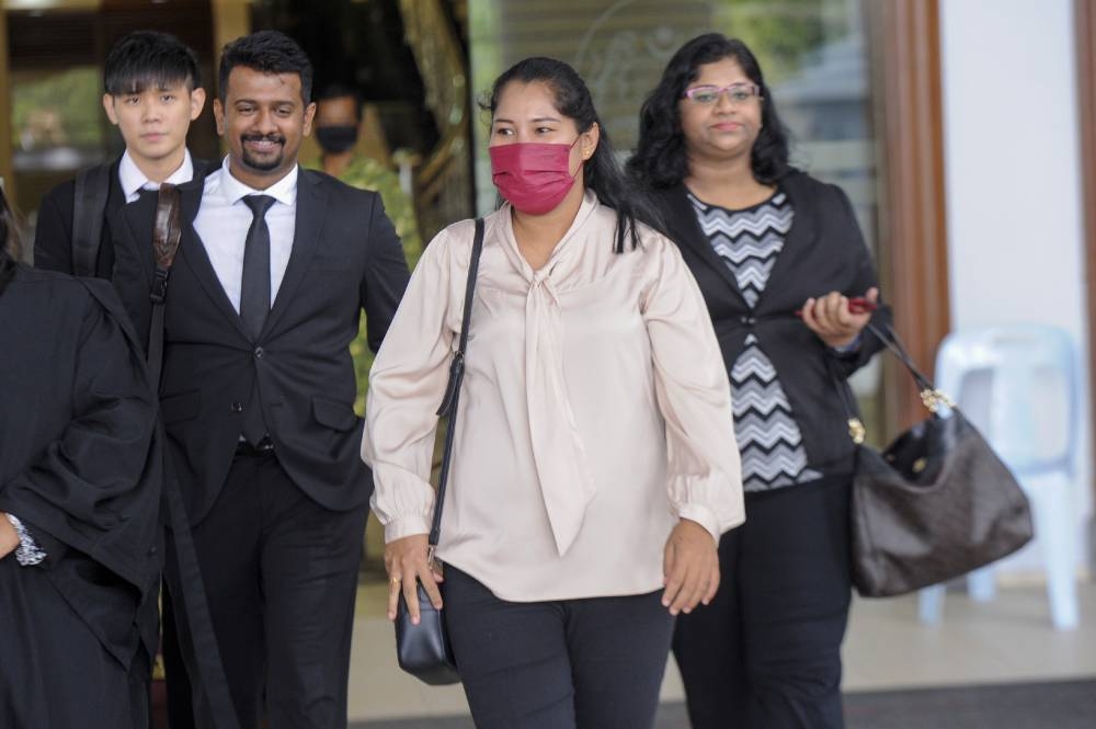 Loh Siew Hong with her lawyers leave the Kuala Lumpur High Court, June 15, 2022. — Picture by Shafwan Zaidon