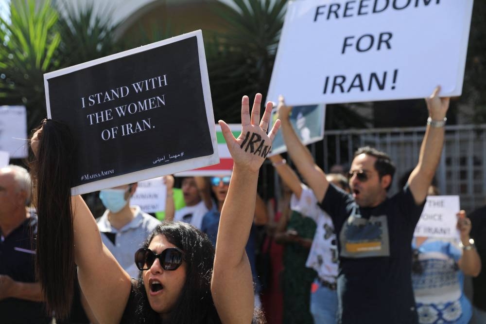 People take part in a protest following the death of Mahsa Amini in Iran, in Nicosia, Cyprus September 25, 2022. — Reuters pic