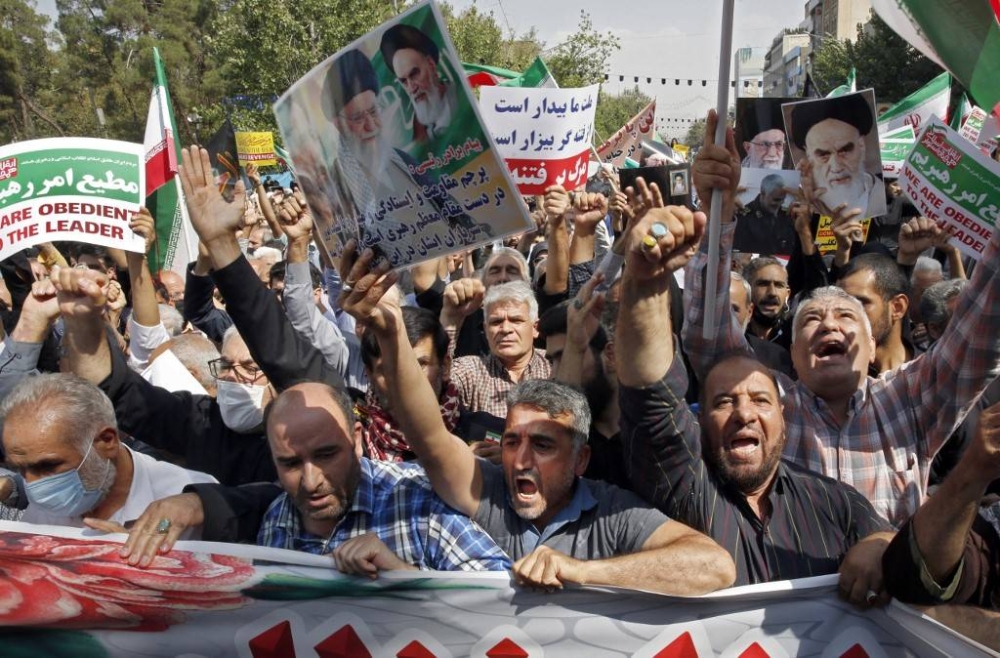 Iranians march during a pro-hijab rally in the capital Tehran on September 23, 2022. Thousands of people marched through Iran's capital during a pro-hijab rally Friday, paying tribute to security forces who have moved to quell a week of protests by what media called ‘conspirators’. — AFP pic