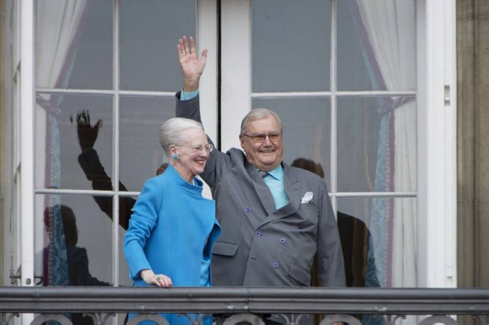 Denmark's Queen Margrethe and Prince Henrik wave from the balcony during Queen Margrethe's 76th birthday celebration at Amalienborg Palace in Copenhagen, Denmark April 16, 2016. — Reuters file pic