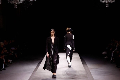 Under a cloud of belt-tightening, Paris Fashion Week struts on