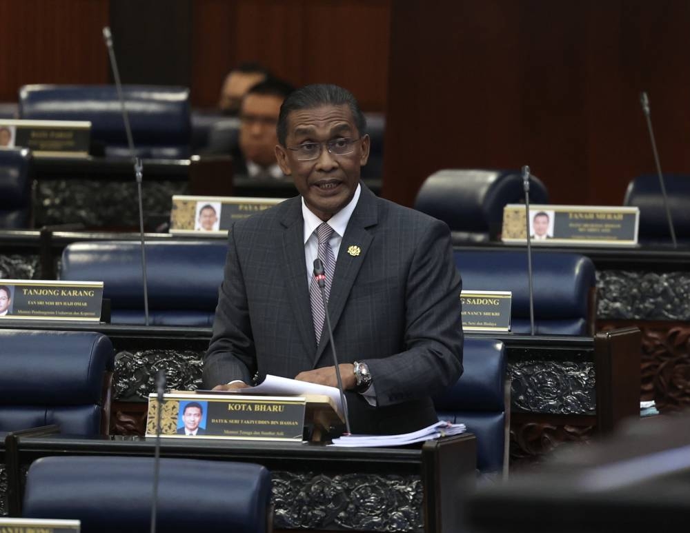 Energy and Resources Minister Datuk Seri Takiyuddin Hassan speaks at the Parliament in Kuala Lumpur October 3, 2022. — Bernama pic