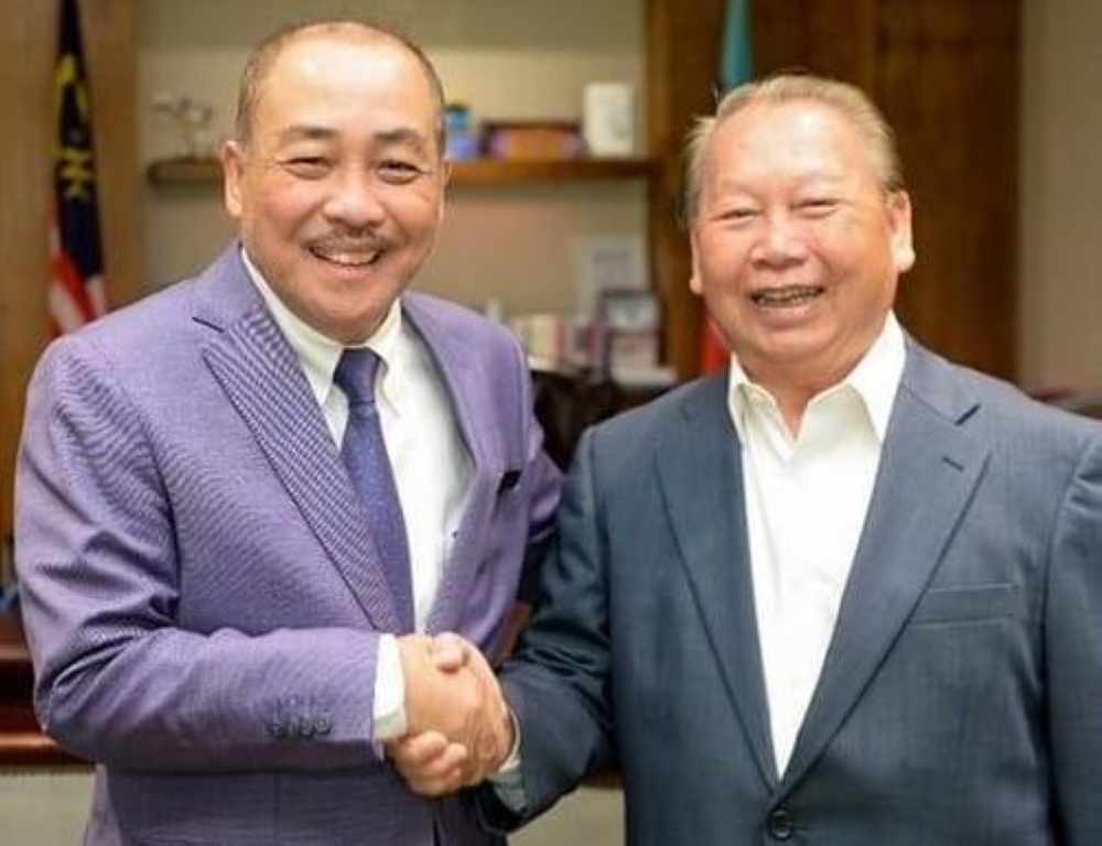 Tan Sri Joseph Pairin Kitingan (right) meeting Chief Minister Datuk Seri Hajiji Noor on Monday. — Borneo Post pic 