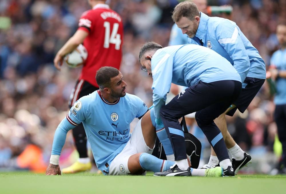 Manchester City's Kyle Walker receives medical attention during the match against Manchester United at the Etihad Stadium, Manchester October 2, 2022. — Reuters pic