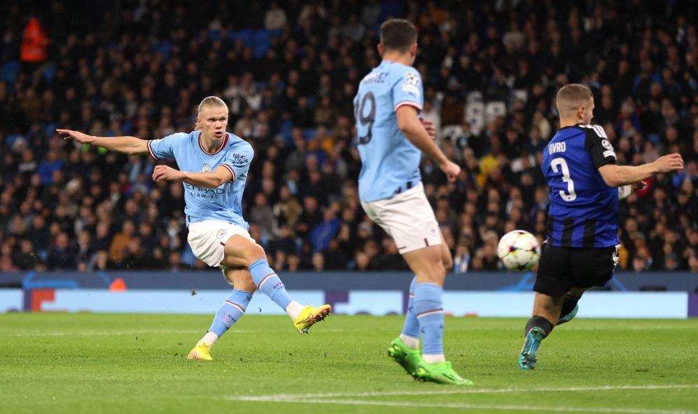 Manchester City's Erling Braut Haaland scores their first goal against FC Copenhagen at the Etihad Stadium, Manchester October 5, 2022. — Reuters pic