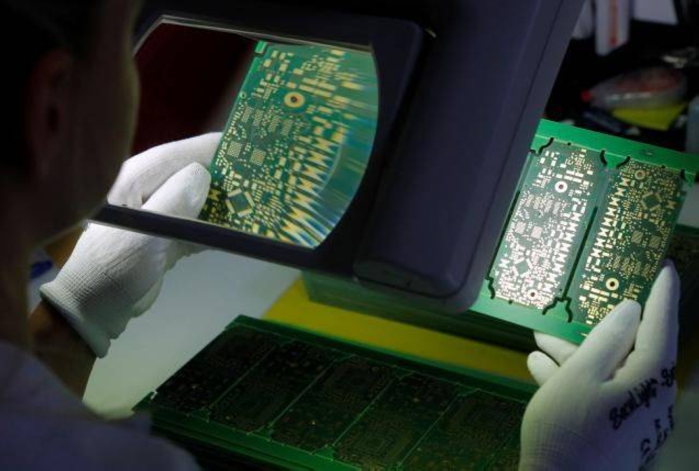 File photo of a worker checking printed circuit boards (PCBs) at the production facility of Austrian PCB maker AT&S in Leoben, Austria, July 5, 2016. — Reuters pic