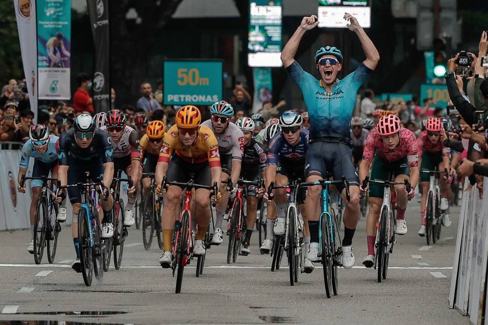 Team Astana Qazaqstan’s Gleb Syritsa celebrates his win after completing the 157.3km journey from Kuala Pilah, Negri Sembilan to the Petronas Twin Tower (KLCC) in 3 hours, 43 minutes and 33 seconds. — Bernama pic 