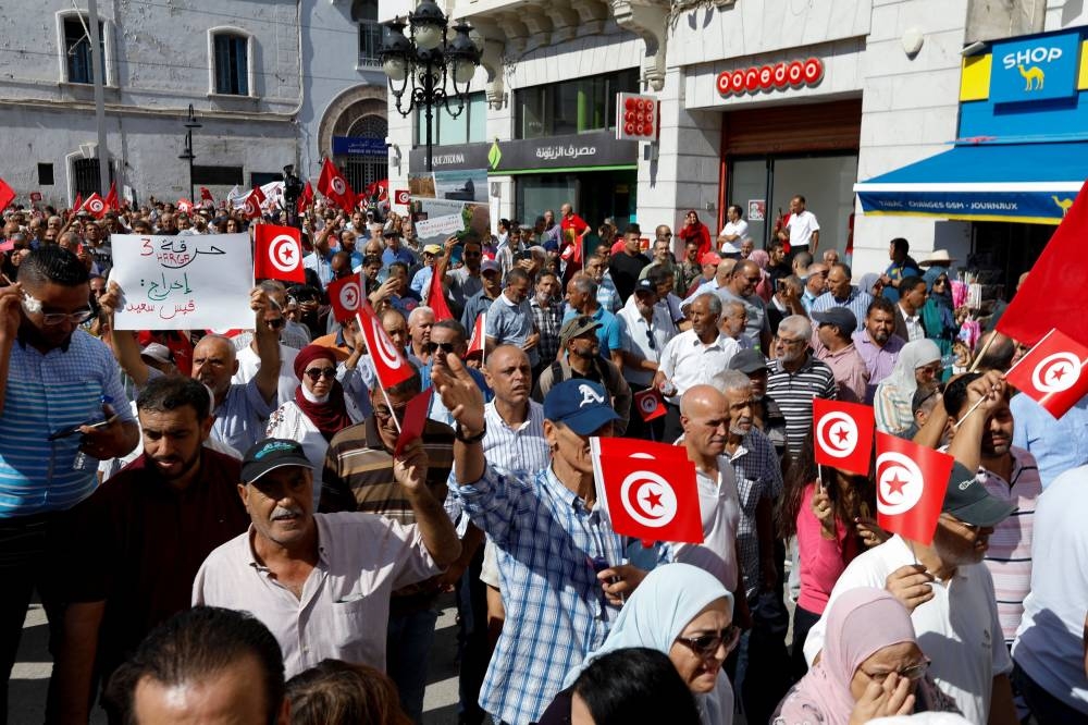 Supporters of Tunisia’s Islamist opposition party Ennahda carry signs and flags during a protest against Tunisian President Kais Saied, in Tunis, Tunisia October 15, 2022. ― Reuters pic