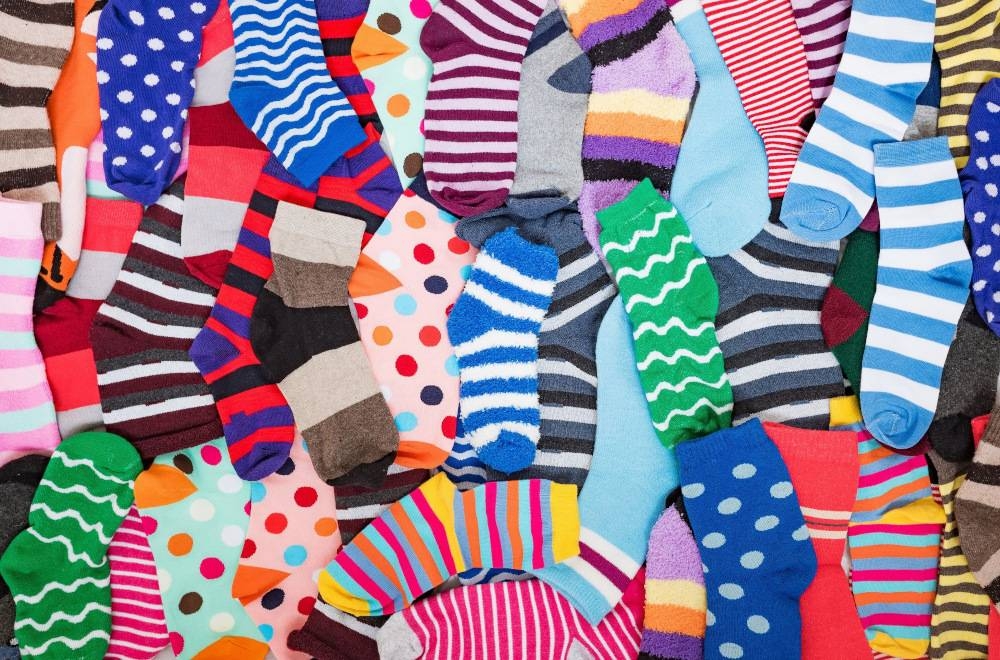 Enyo Studio transforms unused and unsold socks into crop tops and handbags. — Evgen_Prozhyrko/Getty Images/ETX Studio pic