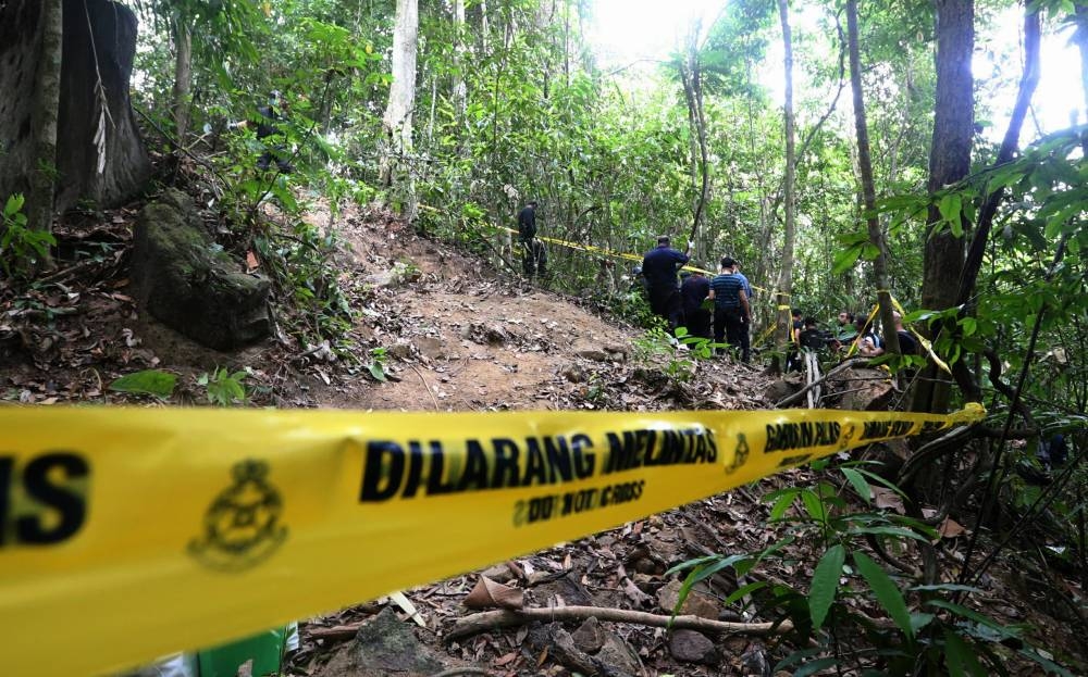 The mass gravesite found near the migrant camp which is guarded by the General Armed Force (PGA) in the middle of the forest at Bukit Wang Burma, near the Malaysia-Thailand border in Perlis in this file picture taken on May 26, 2015. — Picture by Sayuti Zainudin