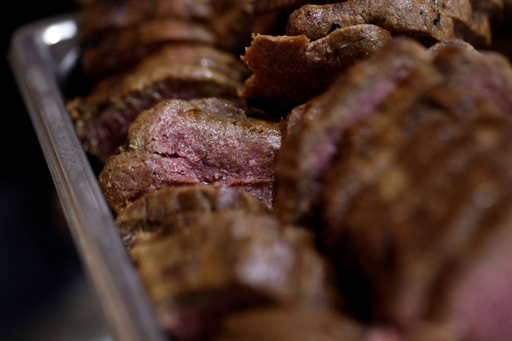 Pieces of 3D printed plant-based vegan meat, produced by Israeli start-up Redefine Meat, are displayed at SIAL food and innovation exhibition in Villepinte, near Paris October 19, 2022. — Reuters pic