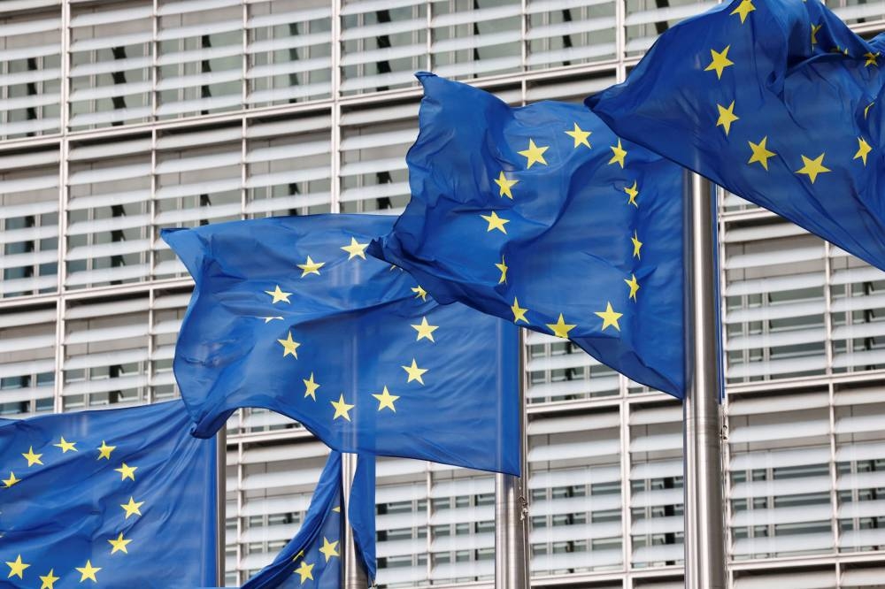 European Union flags flutter outside the EU Commission headquarters in Brussels September 28, 2022. — Reuters pic