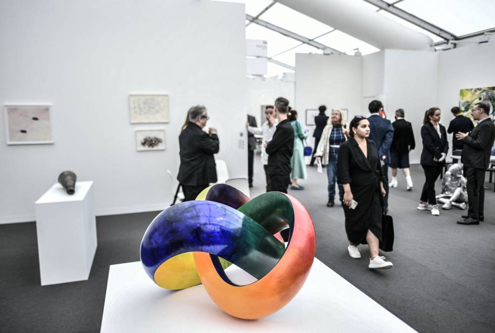 Visitors look at art pieces during the ‘Paris Art Basel’ event, ahead of the official opening of Europe’s biggest contemporary art market in Paris, on October 19, 2022. — AFP pic