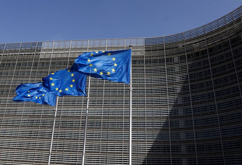 European Union flags flutter outside the EU Commission headquarters in Brussels June 17, 2022. — Reuters pic