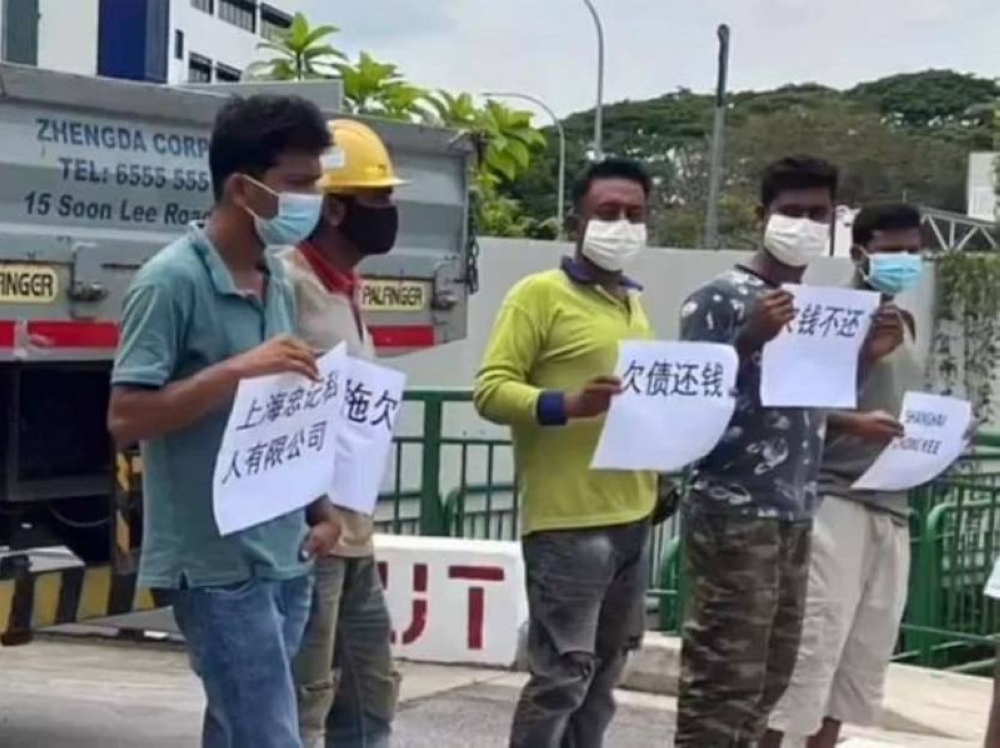 singapore-worker-protest-mom-probes-two-building-firms-helps-five