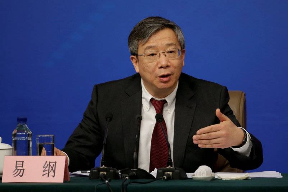 File photo of Yi Gang, central bank governor of the People's Bank of China, attending a news conference in Beijing March 10, 2017. —Reuters pic