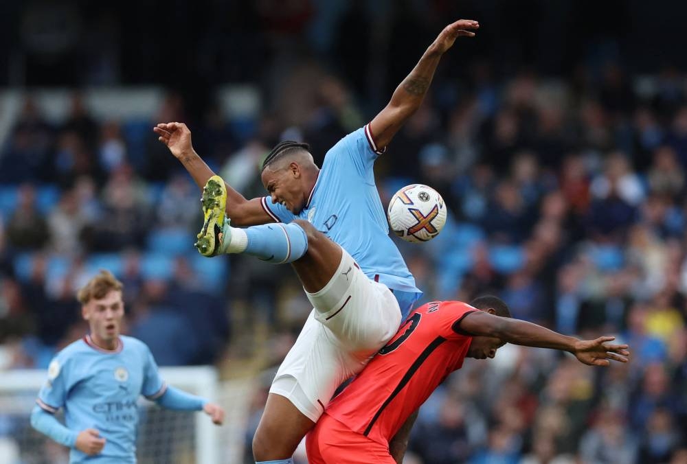 Manchester City's Manuel Akanji in action with Brighton & Hove Albion's Pervis Estupinan at Etihad Stadium, Manchester, October 22, 2022. — Reuters pic