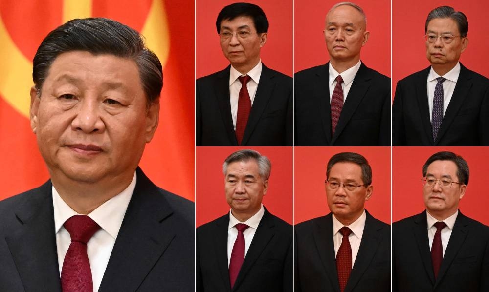 This combination of photos created on October 23, 2022 shows China's President Xi Jinping (left) and other new members of the Communist Party of China's Politburo Standing Committee (top second left to right) Wang Huning, Cai Qi, Zhao Leji, (bottom scond left to right) Li Xi, Li Qiang and Ding Xuexiang, as they meet the media in the Great Hall of the People in Beijing on October 23, 2022. — AFP pic